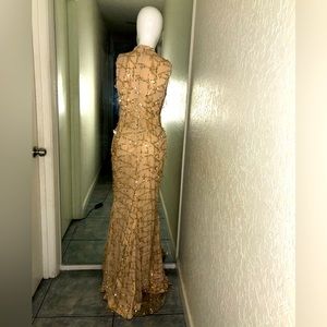 Nice gold sequin gown/pika boo on the sides little gold sequin drops by XTAREN